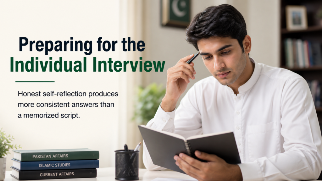 Candidate reflecting on personal notes ahead of an individual interview during selection